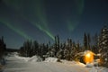 Aurora Borealis over little house Royalty Free Stock Photo