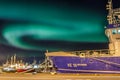 Aurora borealis over Reykjavick boat harbour in Iceland