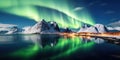 Aurora borealis over the sea, snowy mountains and city lights at night. Northern lights in Lofoten islands, Norway. Starry sky