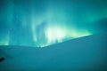 Aurora borealis over Sweden snowy mountain