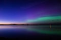 Aurora borealis reflected over a lake
