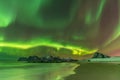 Aurora Borealis reflected in the sea on Myrland beach