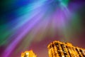 Aurora borealis starry night over the city and houses Royalty Free Stock Photo