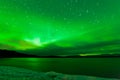 Aurora borealis starry night sky over Lake Laberge