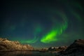 Aurora Borealis in Tromso, Norway in front of the Norwegian fjord, winter season, long shutter speed Royalty Free Stock Photo