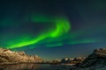 Aurora Borealis in Tromso, Norway in front of the Norwegian fjord, winter season, long shutter speed Royalty Free Stock Photo