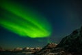 Aurora Borealis in Tromso, Norway in front of the Norwegian fjord, winter season, long shutter speed Royalty Free Stock Photo