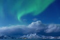 Aurora borealis, Tronso, Norway.  Green northern lights over Fjord And Mountains,   Starry sky and Royalty Free Stock Photo