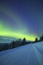 Aurora borealis in a winter landscape, Finnish Lapland Royalty Free Stock Photo