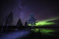 Aurora at clear skies and like reflecting green northern lights like mirror at Scandinavian countryside