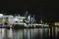 Aurora cruiser on Neva river embankement at night time  symbol of revolution. Royalty Free Stock Photo