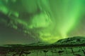 Aurora polaris above mountains at north iceland in winter.northern lights landscape Royalty Free Stock Photo