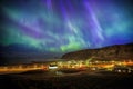 Auroral display over Vik city Royalty Free Stock Photo