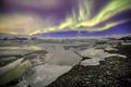 Auroral over the glacier lagoon Jokulsarlon in Iceland.