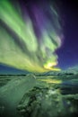 Auroral over the glacier lagoon Jokulsarlon in Iceland.