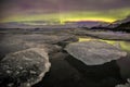 Auroral over the glacier lagoon Jokulsarlon in Iceland. Royalty Free Stock Photo