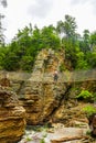 Visitor crossing adventurous rope bridge over Ausable River at Ausable Chasm in Upstate New York Royalty Free Stock Photo