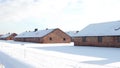 Auschwitz Birkenau barracks in winter. German Nazi concentration and extermination camp Royalty Free Stock Photo