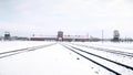 Auschwitz Birkenau Nazi concentration camp and railroad tracks in winter Royalty Free Stock Photo