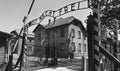Auschwitz Concentration Gate, ARBEIT MACHT FREI sign. Sunny day on the July 7th, 2015. Black and white. Krakow, Poland Royalty Free Stock Photo