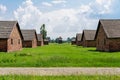 Auschwitz II - Birkenau barracks and watch tower Royalty Free Stock Photo