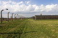 Auschwitz II -Birkenau Extermination camp barbed wire fence and wooden housing Royalty Free Stock Photo