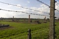 Auschwitz II -Birkenau Extermination camp outdoors behind a barbed wire fence Royalty Free Stock Photo