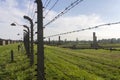 Auschwitz II -Birkenau Extermination camp outdoors behind a barbed wire fence