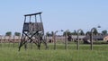 Auschwitz II - Birkenau, guard station and barbed wire fence - July 6th, 2015 - Krakow, Poland Royalty Free Stock Photo