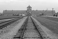 AUSCHWITZ, POLAND, OCTOBER 12, 2013: Rail entrance to concentration camp at Auschwitz Birkenau KZ, black and white