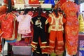 Auspicious clothes to celebrate Chinese New Year Hanging for sale in a community place. Chinese New Year Clothes