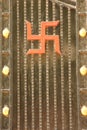 An auspicious swastika symbol on a door