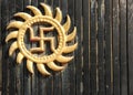 An auspicious swastika symbol on a door