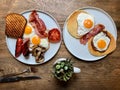 Aussie / Australian Breakfast with Brioche Toast, Fried Eggs, Crispy Bacon Sausage, Salty Pancakes and Mushrooms