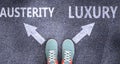 Austerity and luxury as different choices in life - pictured as words Austerity, luxury on a road to symbolize making decision and