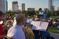 Musicians in the foreground and the city in the distance