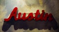 Austin Texas Metal Sign Hanging on Textured Wall