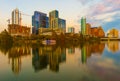 Austin, Texas with new buildings rising, reflecting in lady Bird Lake during sunset / Austin Skyline and new constructions Royalty Free Stock Photo