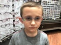 Child trying on new eye glasses