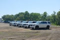 A fleet of White Chevy Tahoe equipped with Feniex Emergency Products