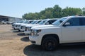 A fleet of White Chevy Tahoe equipped with Feniex Emergency Products