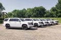 A fleet of White Chevy Tahoe equipped with Feniex Emergency Products