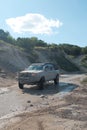 Off-road Toyota truck covered in Mud