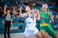 Australia and Argentina basketball players in a competitive action