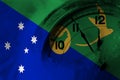 Australia, Australian, Christmas Island flag with clock close to midnight in the background. Happy New Year concept