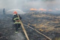 Australia bushfires, The fire is fueled by wind and heat. firefighters spray water to wildfire Royalty Free Stock Photo