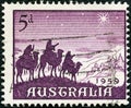 AUSTRALIA - CIRCA 1959: A stamp printed in Australia from the `Christmas` issue shows the Approach of the Magi, circa 1959. Royalty Free Stock Photo