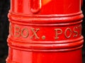 Australia Classic red mail post box in close up, isolated on black background. Royalty Free Stock Photo