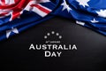 Australia day concept. Australian flag with the text Happy Australia day against a blackboard background. 26 January Royalty Free Stock Photo