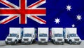 Australia flag in the background. Five new white trucks are parked in the parking lot. Truck, transport, freight transport. Royalty Free Stock Photo